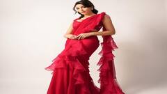 Nora Fatehi Photos: રેડ રફલ્ડ સાડીમાં નોરા ફતેહીએ બતાવ્યો જલવો, તસવીરોએ લગાવી આગ