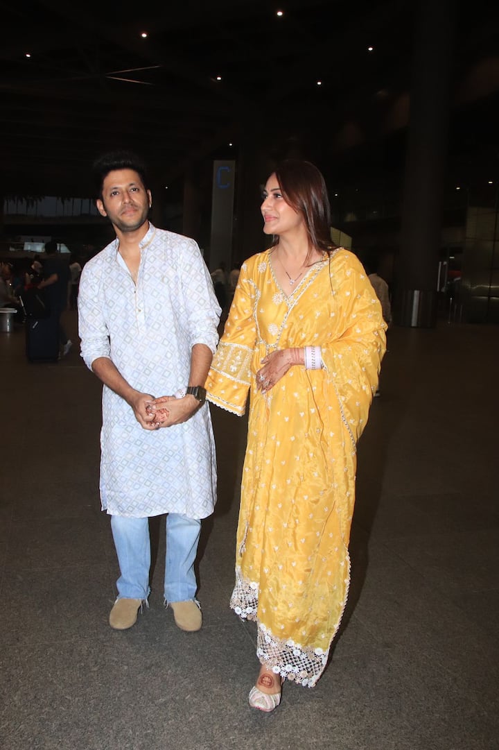 In their first public appearance after the wedding, Surbhi was seen wearing a yellow suit. (Image: Manav Manglani)