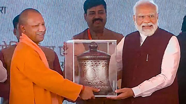 PM Modi was felicitated by UP CM Yogi Adityanath during the foundation stone laying and inauguration ceremony of various developmental projects in Azamgarh on Sunday. (Photo: PTI)