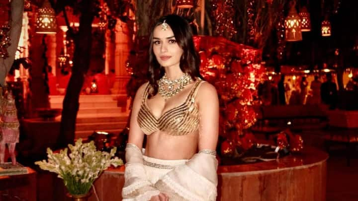 Manushi Chhillar treated fans with pictures in a gold and ivory-coloured lehenga looking dapper as ever