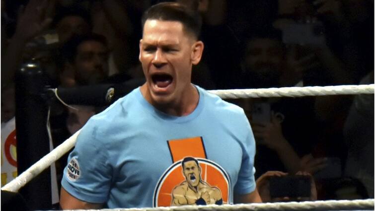 John Cena goes Oscar Stage without cloths know the real reason behind his stunt John Cena at Oscar Stage: অস্কারের মঞ্চে হঠাৎ নগ্ন হয়ে হাজির জন সিনা, সাহসীকতার নেপথ্যে ছিল অন্য কারণ!