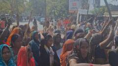 शराब की दुकान बंद कराने के लिए लाठी-डंडे लेकर पहुंची महिलाएं, विरोध करते हुए सड़क पर दिया धरना