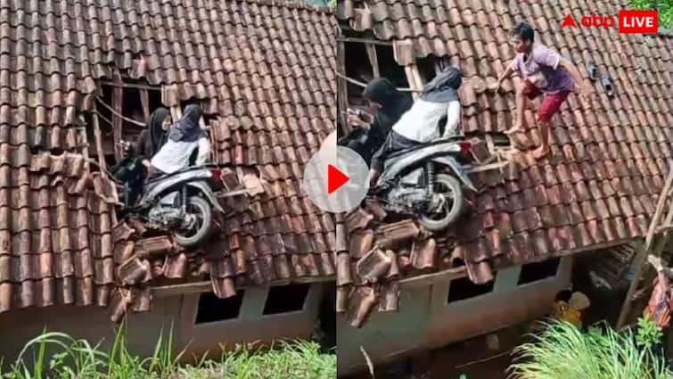 Two girls climbed onto the roof of a house after the scooter became unbalanced trending Video: ये कैसी पार्किंग, स्कूटी लेकर छत पर चढ़ गई दो लड़कियां! देखें मजेदार वीडियो