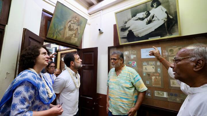 During their visit, they paused to reflect upon a photograph depicting their grandmother, Indira Gandhi, alongside Mahatma Gandhi. (Source: PTI)