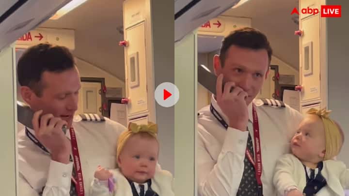 Pilot Makes Sweet Announcement During His First Flight With Baby Daughter On Board Watch Video Watch: अपनी छोटी सी बेटी को गोद में लेकर फ्लाइट में अनाउंसमेंट करता दिखा पायलट, बच्ची का रिएक्शन वायरल