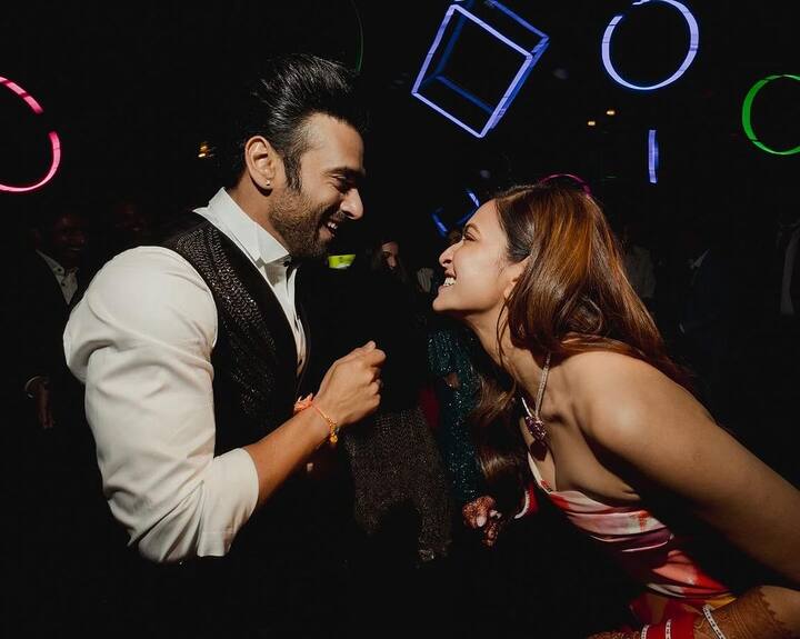 There is also a photo of them taken from the dance floor and a monochrome one of them smiling and posing.