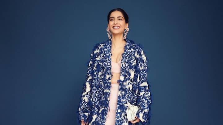 Sonam Kapoor treated fans with pictues in a beige and blue outfit looking her dapper best