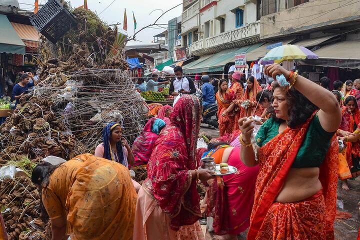 Gurugram: Women perform rituals in preparation of 'Holika Dahan' on the eve of Holi festival, in Gurugram, Sunday, March 24, 2024.  (Image source: PTI Images)