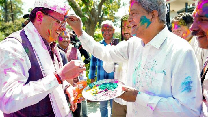 Former State CM Harish Rawat applied Gulal to CM Dhami during Holi celebrations(Image source: PTI)