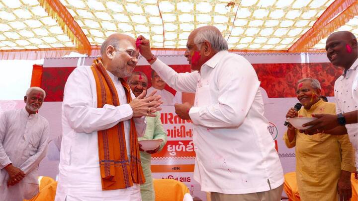 Union Home Minister Amit Shah with Gujarat Chief Minister Bhupendra Patel during the 'Dhuleti Mahotsav' celebrations. (Image source: PTI)