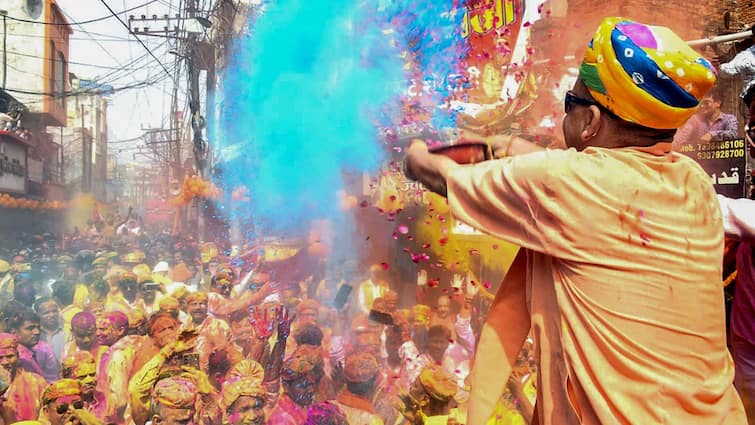 Uttar Pradesh CM Yogi Adityanath plays Holi Lord Narsingh Shobha Yatra Gorakhpur video Yogi Adityanath Participates In Gorakhpur Holi Celebrations, Lord Narsimha Shobha Yatra — WATCH