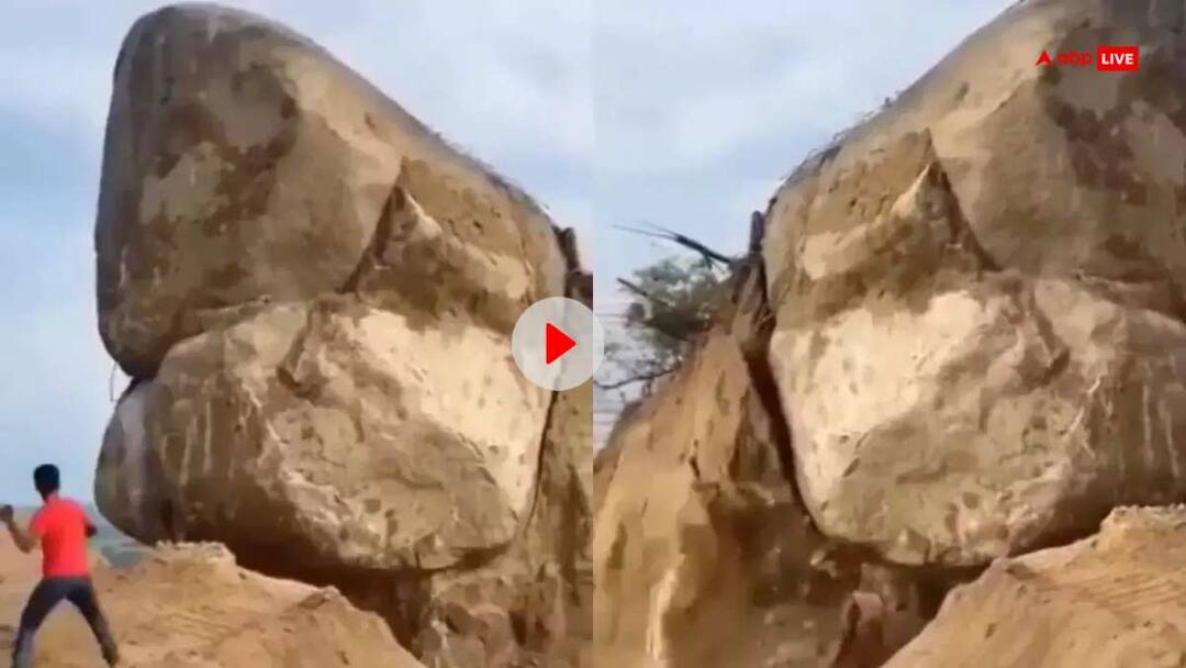 man stabbed moutain rock with one pebble video goes viral on internet VIDEO: शख्स ने एक कंकड़ से गिरा दिया विशालकाय चट्टान, पहले नहीं देखा होगा ऐसा नजारा