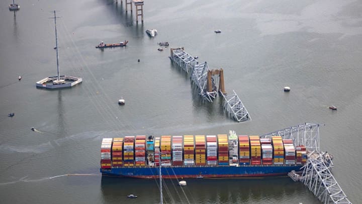 It struck one of the bridge's supports, causing the structure to collapse like a toy and bringing a section of the span to rest on the bow. (Image Source: Getty Images)