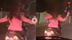 Video: बिजी सड़क पर हाथ छोड़कर स्कूटी दौड़ाती नजर आई लड़की