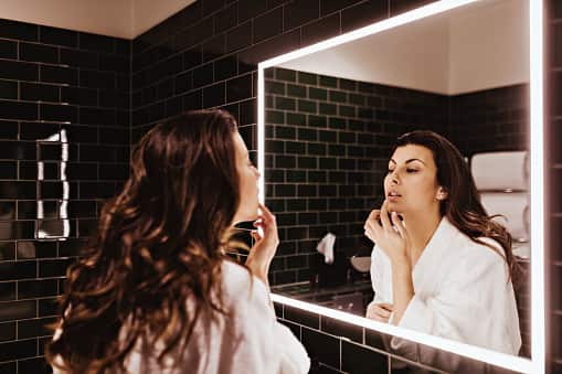 Lip Care: Don't forget to moisturise your lips with a hydrating lip balm to keep them soft and supple. (Image Source: Getty)