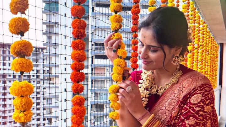 Arti Singh shared a series of pictures of herself in a red saree on Instagram sparking engagement rumours