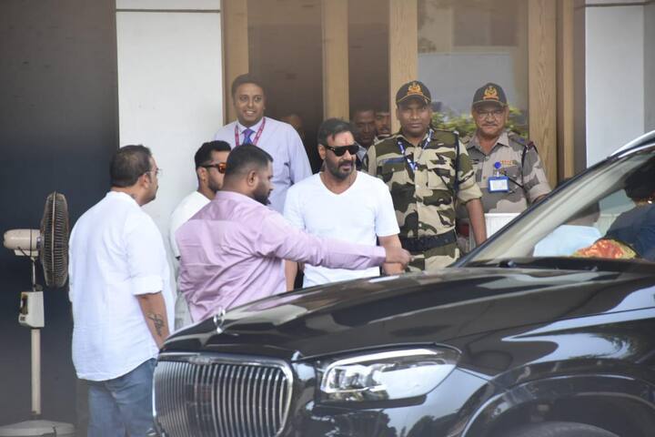 The video shows people giving him flowers, and cheering, while Ajay says,