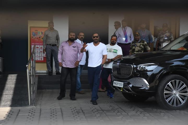 Ajay Devgn greeted his fans and paparazzi stationed outside the airport.