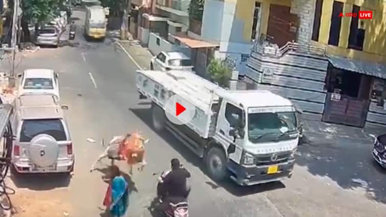 Banglore road accident Bike rider fell down after being hit by a bull in Mahalaxmi Layout cctv video goes viral