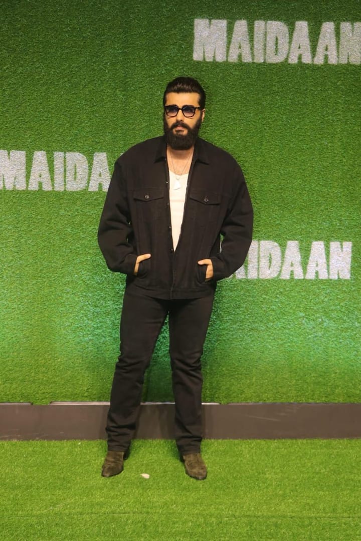 Arjun Kapoor poses for the shutterbugs in black pant and jacket.