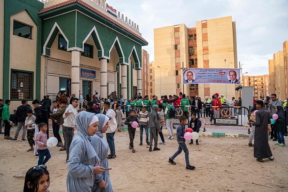 Muslims attend the Eid al-Fitr prayers dedicated to Palestinians in stranded in El Arish on April 10, 2024 in Arish, Egypt. (Image Source: Getty)