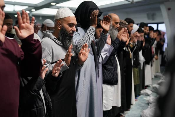Worshippers gather for morning prayers at Green Lane Masjid in Birmingham, as the holy month of Ramadan comes to an end and Muslims celebrate Eid al-Fitr. (Image Source: Getty)