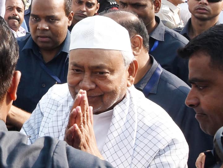 Chief Minister Nitish Kumar greets others during namaz on the occasion of Eid-al-Fitr celebrations at Gandhi Maidan, in Patna. (Image Source: PTI)
