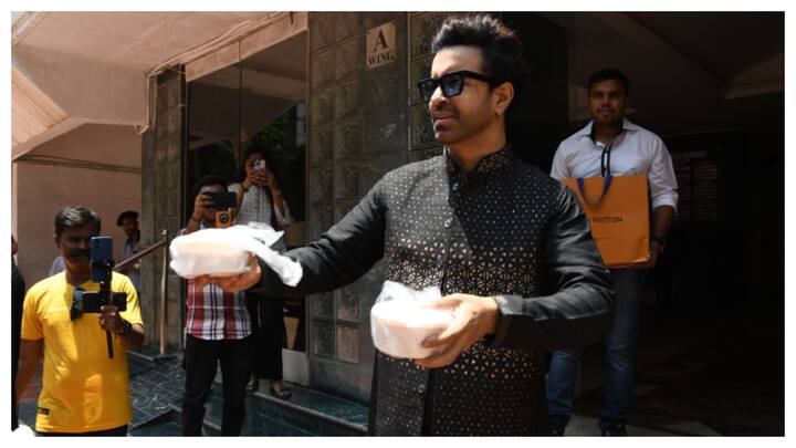 Actor Aamir Ali on Thursday celebrated the festival of Eid with the paparazzi outside his residence and distributed them traditional delicacy made by his mother.