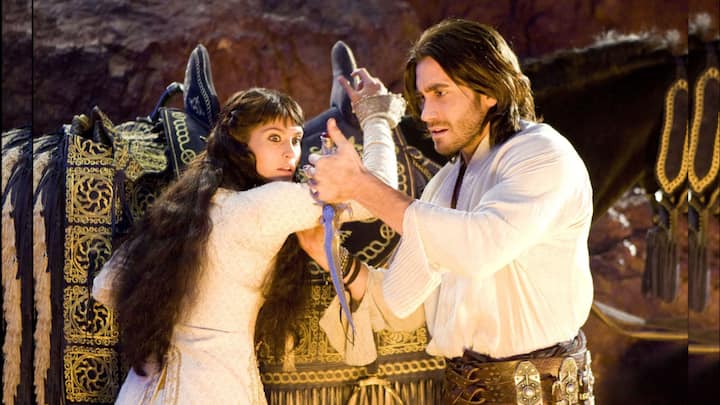 Prince Of Persia- The Sands Of Time (2010): The Sands of Time, located in the sacred city of Alamut, possess the extraordinary ability to rewind time. Following an assault on the city, Dastan (played by Jake Gyllenhaal), the adopted son of the Persian king, obtains a dagger that grants its wielder control over the Sands. Accused of regicide, Dastan flees with Tamina (portrayed by Gemma Arterton), a princess from Alamut. Together, they embark on a journey to safeguard the ancient artefact from malevolent forces and uncover the identity of the king's killer. The movie is based on the video game titled 'Prince of Persia: The Sands of Time'. (Image Source: IMDb)