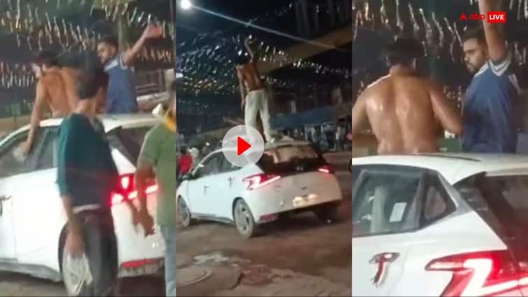 Prayagraj man bathed with alcohal and dance on car shocking video goes viral up news Watch: शराब से नहाया, कार की छत पर शर्ट उतारकर नाचा, बीच सड़क पर पार्टी करते शख्स का Video वायरल
