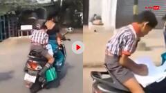Video: 'जुनून है या मजबूरी?', चलती स्कूटी पर पढ़ता दिखा बच्चा, सोशल मीडिया पर छिड़ी बहस