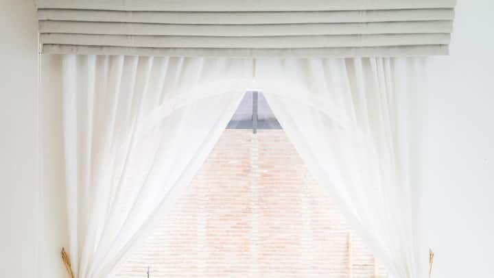 Light Colored Curtains: Light colored curtains reflect sunlight well, thus reducing heat.  White or yellow curtains are perfect.