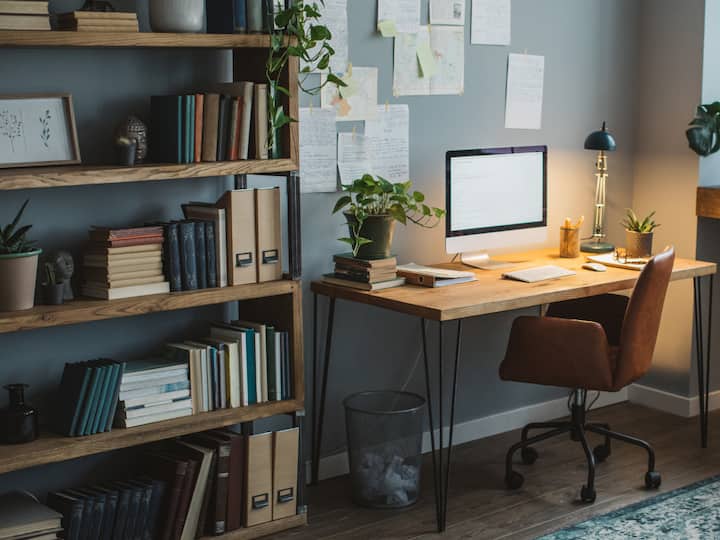 6. Declutter for clarity: A cluttered workspace can lead to a cluttered mind. Invest in storage solutions like a bookshelf to keep your office tidy and functional. A clear and organised space will help you focus and enhance your productivity. (Image source: getty images)