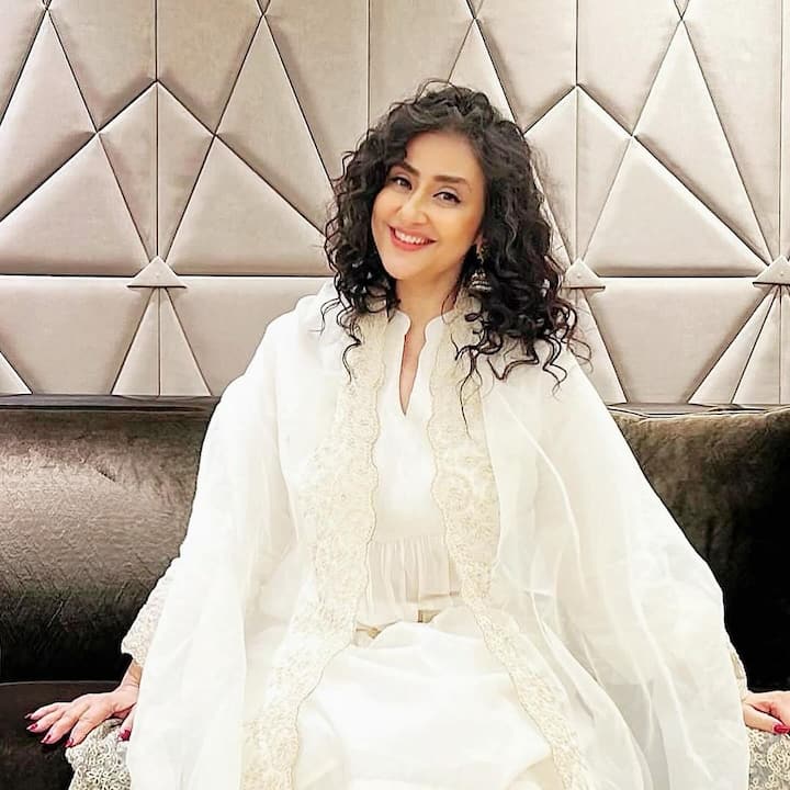 Radiating elegance, she donned an off-white ethnic suit, showcasing her timeless charm.