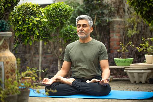 4. Practice mindfulness exercises or meditation to help you maintain your attention and sense of grounding in the here and now. Stress and anxiety levels may drop as a result. (Image Source: Getty)