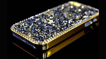 iPhone 5 Black Diamond ($15 million): Crafted from 135 grams of solid 24-carat gold, the iPhone 5 Black Diamond, priced at $15 million, underwent a meticulous nine-week construction process. Its frame features 600 pristine white diamonds, with an additional 53 adorning the Apple logo on the rear. Noteworthy is the use of sapphire in the screen, adding to its opulence. The standout feature of this luxurious black-and-gold iPhone 5 is the singular, flawless black deep-cut diamond that now graces the home button. This remarkable 26-carat black diamond originates from a Chinese businessman, who collaborated with luxury artisan Stuart Hughes to bring this bespoke device to life. (Image Source: Apple)