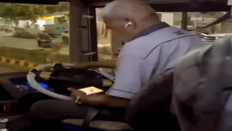 Ahmedabad: A BRTS bus driver was caught on camera watching an IPL match while driving Ahmedabad: હવે BRTS બસ વિવાદમાં આવી, ચાલુ બસે ડ્રાઇવર જોઇ રહ્યો હતો IPL મેચ