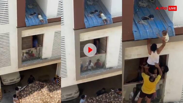 newborn baby reached the rooftop balcony and was rescued with great difficulty video viral on social media Video: बालकनी से नीचे गिरने ही वाला था नवजात, लोगों ने मिलकर इस तरह बचाई जान- वीडियो आया सामने