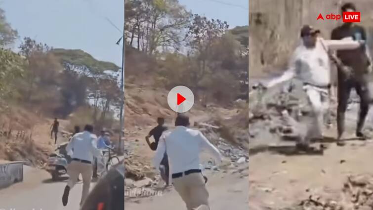 traffic Police officer running after the man carrying a stone in hand video viral Video: युवक के पीछे दौड़ता रहा ट्रैफिक पुलिसकर्मी, आखिर में मजबूर होकर उठा लिया पत्थर- वीडियो हुआ वायरल