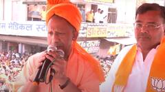 सीएम योगी का मैनपुरी में रोड शो, बीजेपी कार्यकर्ताओं ने बुलडोजर पर चढ़कर बरसाए फूल, देखें तस्वीरें