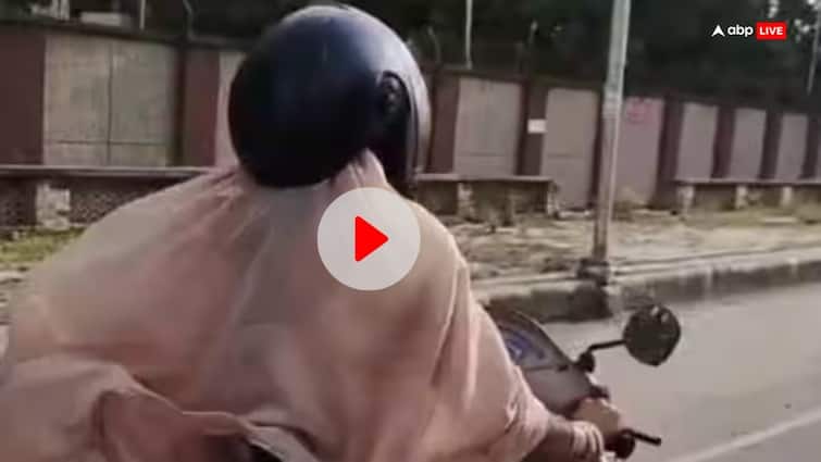 Kanpur a woman unique helmet Wearing on road drive video goes viral ann Kanpur News: महिला का अनोखा 'हेलमेट' देख चौंक जाएंगे आप, Video देख कंट्रोल नहीं होगी हंसी