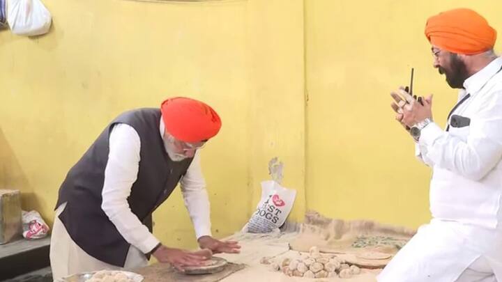 Prime Minister Modi also helped the Gurdwara management cook food for the langar. (Photo: ANI)