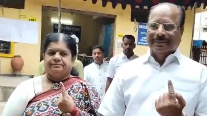 Tripura Governor N Indrasena Reddy along with his wife, shows his finger marked with ink after casting his vote at a polling booth in Saleem Nagar, Hyderabad. (Photo: ANI)