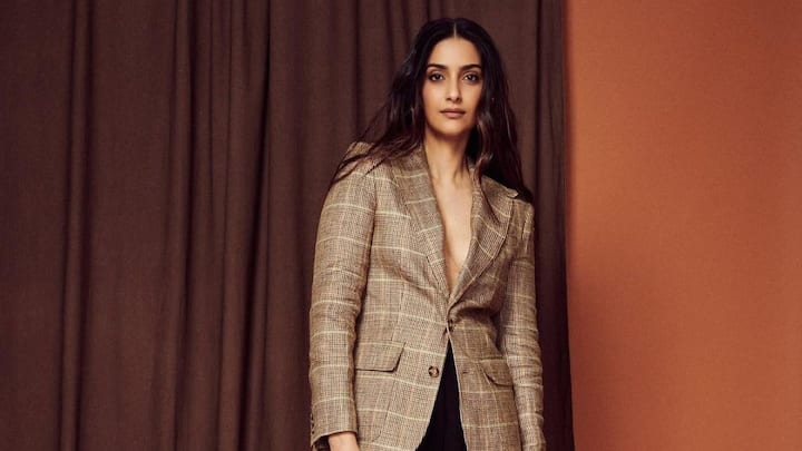 Sonam Kapoor makes fashion statement again as she wears a gorgeous plaid blazer with chic black trousers.