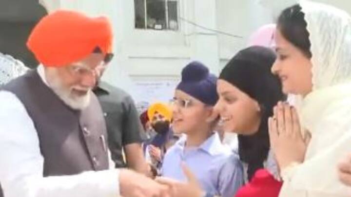 Prime Minister was seen shaking hands with a small kid at the Gurudwara premises. (Photo: ANI)