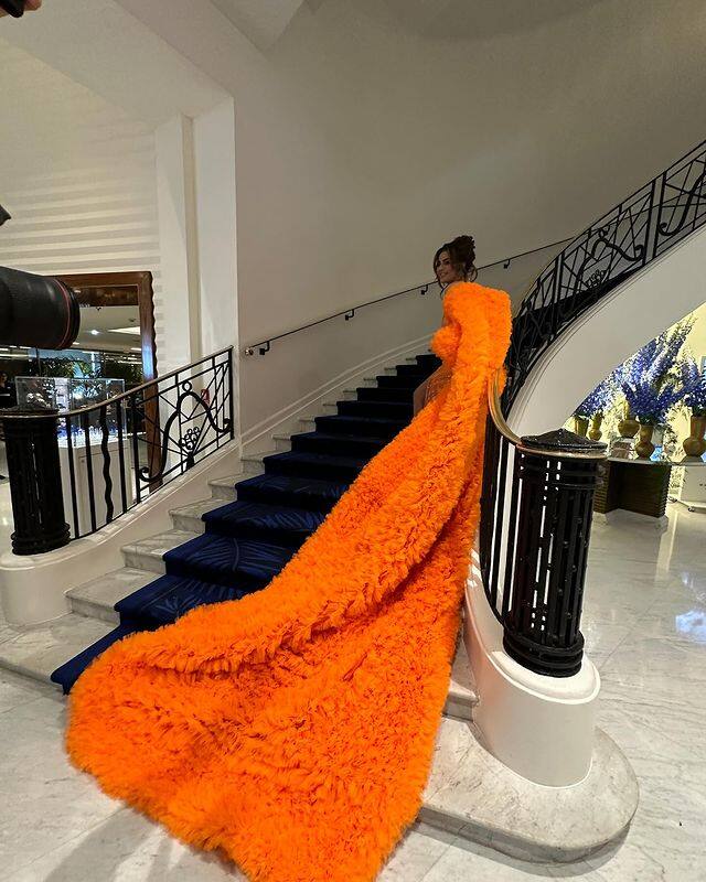The actor-singer made heads turn with her orange long-trail gown on the opening day of Cannes Film Festival 2024.