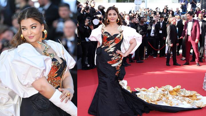 ঐশ্বর্য্যের কানে ছিল সোনালি রঙের হুপ দুল। মধ্যমায় মানানসই আংটি। খোলা চুলে মানানসই ছিমছাম মেকআপ ছিল ঐশ্বর্য্যর। তবে ঐশ্বর্য্যর এই থ্রিডি গোল্ড ফ্লোরাল গাউন চর্চার পাশাপাশি কটাক্ষও কুড়িয়েছে। (ছবি সৌজন্য: গেটি ইমেজ)