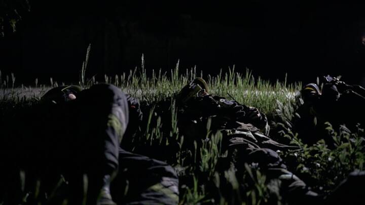 Employees of the State Emergency Service lie on the ground due to the threat of a second strike after a Shahed-136 unmanned kamikaze drone attack in Kharkiv, Ukraine.  (Photo: Getty)