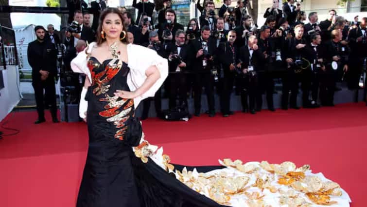 Aishwarya Rai Bachchan Cannes film festival 2024 black golden gown Entertainment News Aishwarya Rai Bachchan: নজরই পড়ল না হাতের প্লাস্টারে, কালো-সোনালি গাউনে কানের রেড কার্পেটে তাক লাগালেন ঐশ্বর্য্য