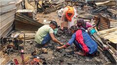 गुरुग्राम स्लम में आग लगने से 65 झोपड़ियां जलकर खाक, राख के बीच सामान ढूंढते दिखे लोग